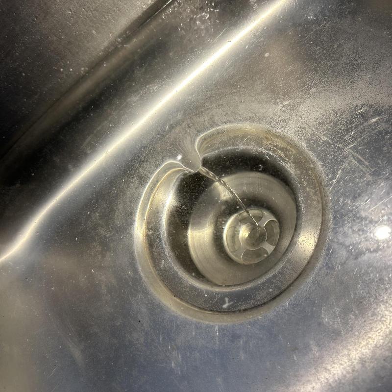 Kitchen sink drain flow test after clog clearing