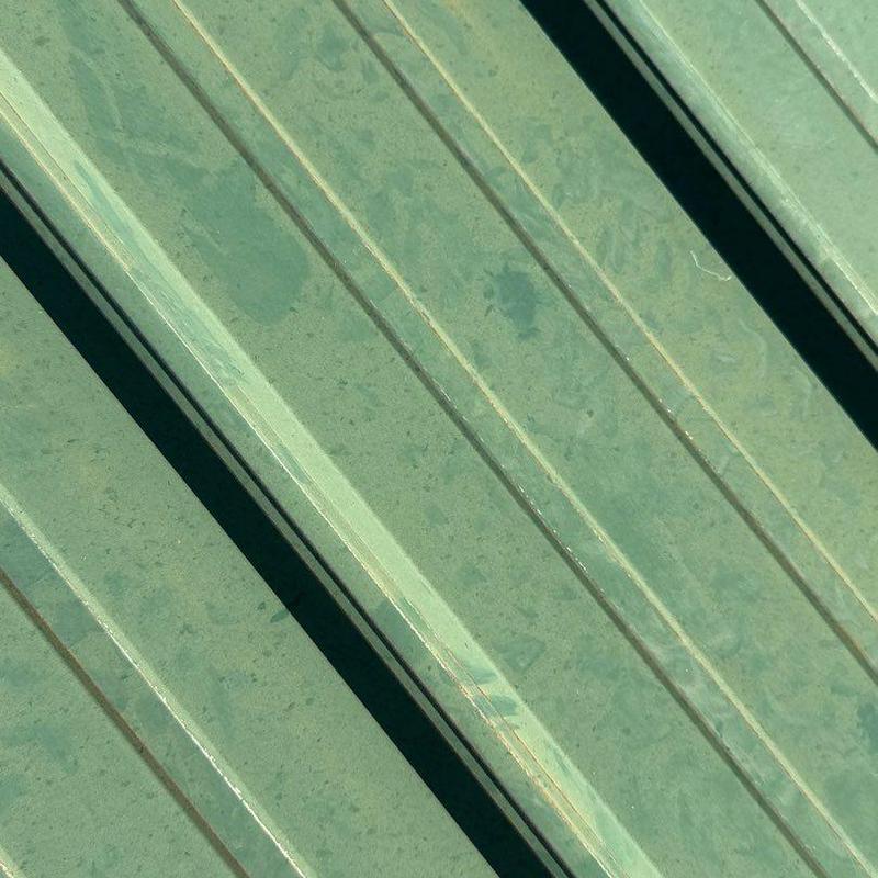 Metal roof panels with weathering and rust marks