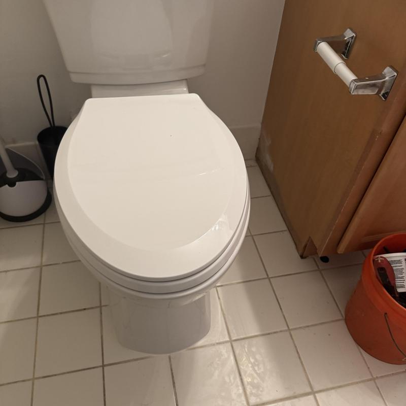 American Standard toilet installation in bathroom
