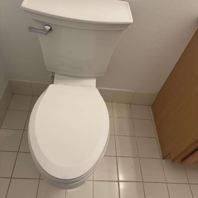 American Standard toilet installation in bathroom corner