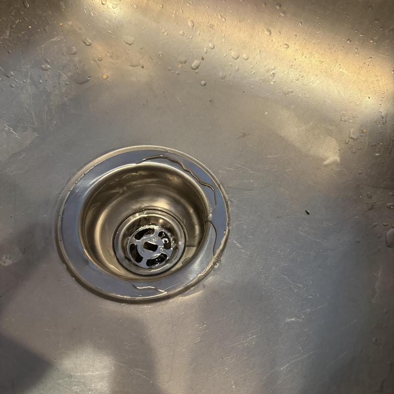 Kitchen sink strainer replacement in stainless steel sink