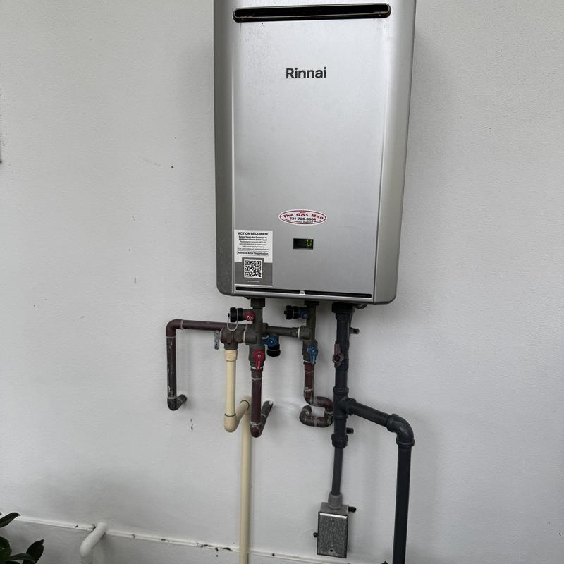 Tankless water heater with connected piping system