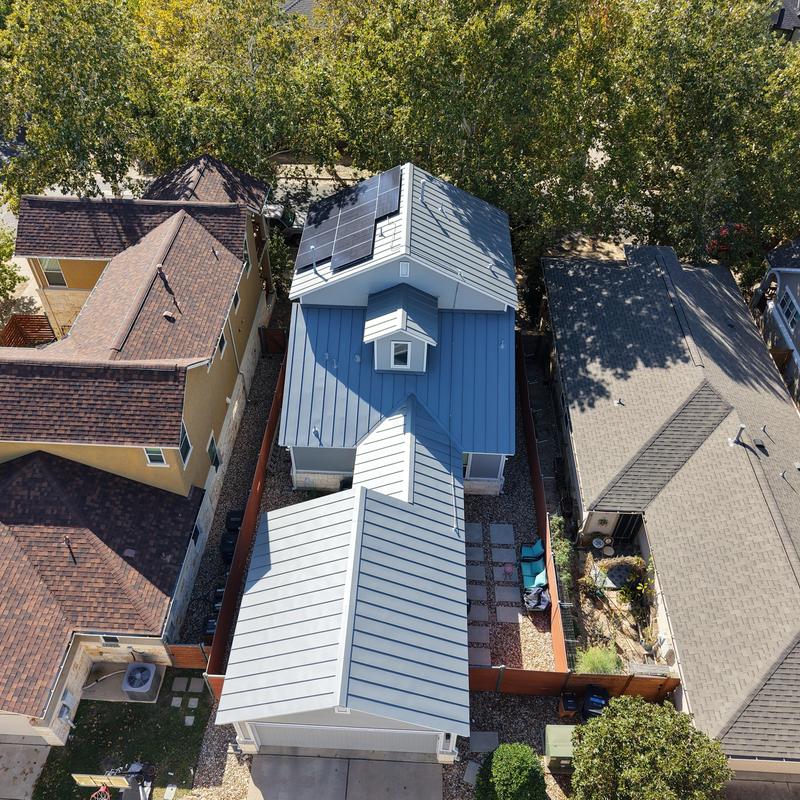 Standing seam metal roof with solar panels installed