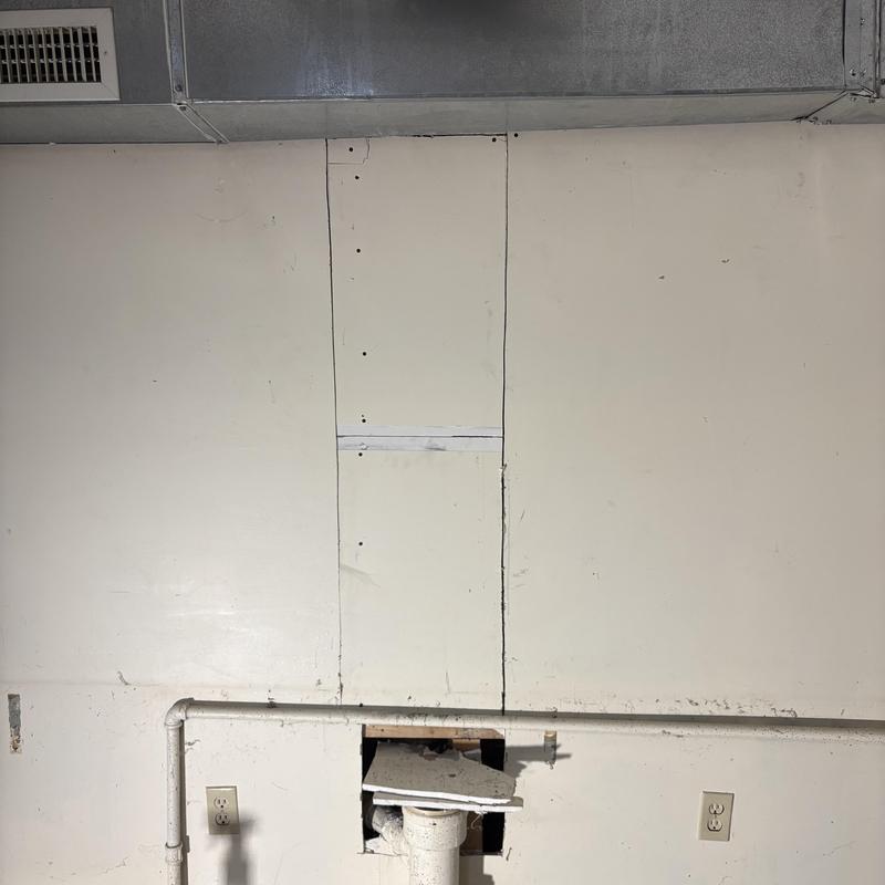 4-inch PVC waste stack repair behind basement wall