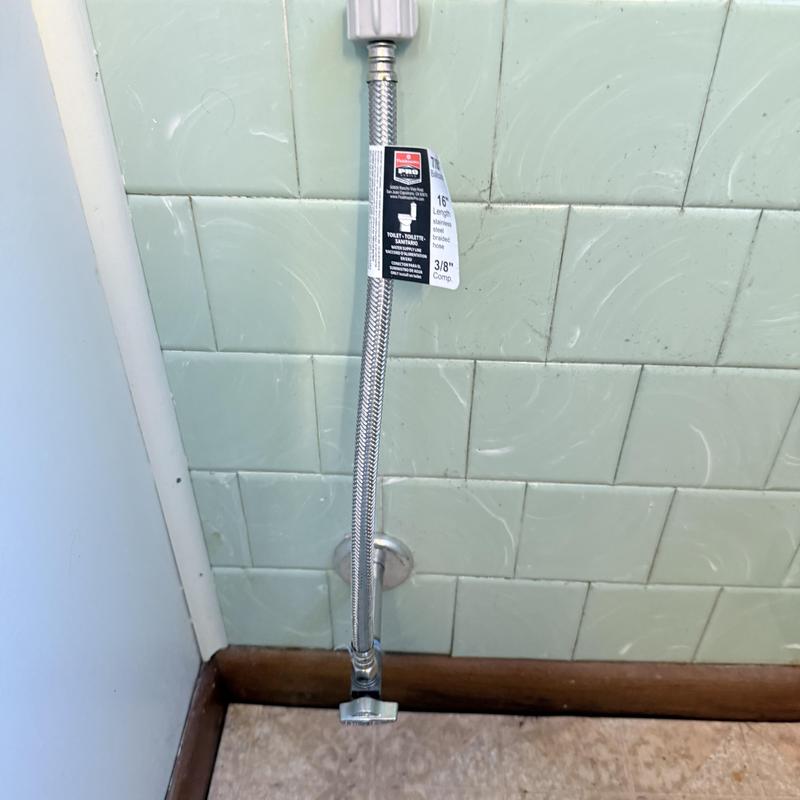Toilet supply line with new flexible braided hose installed