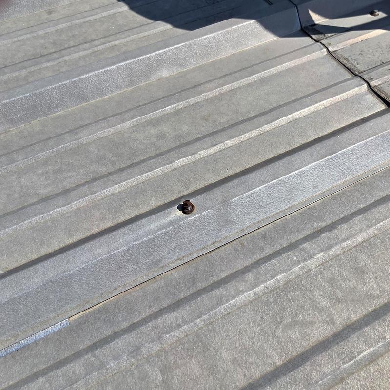 Metal roof screw rust and potential leak point Metal roof screw rust and potential leak point
