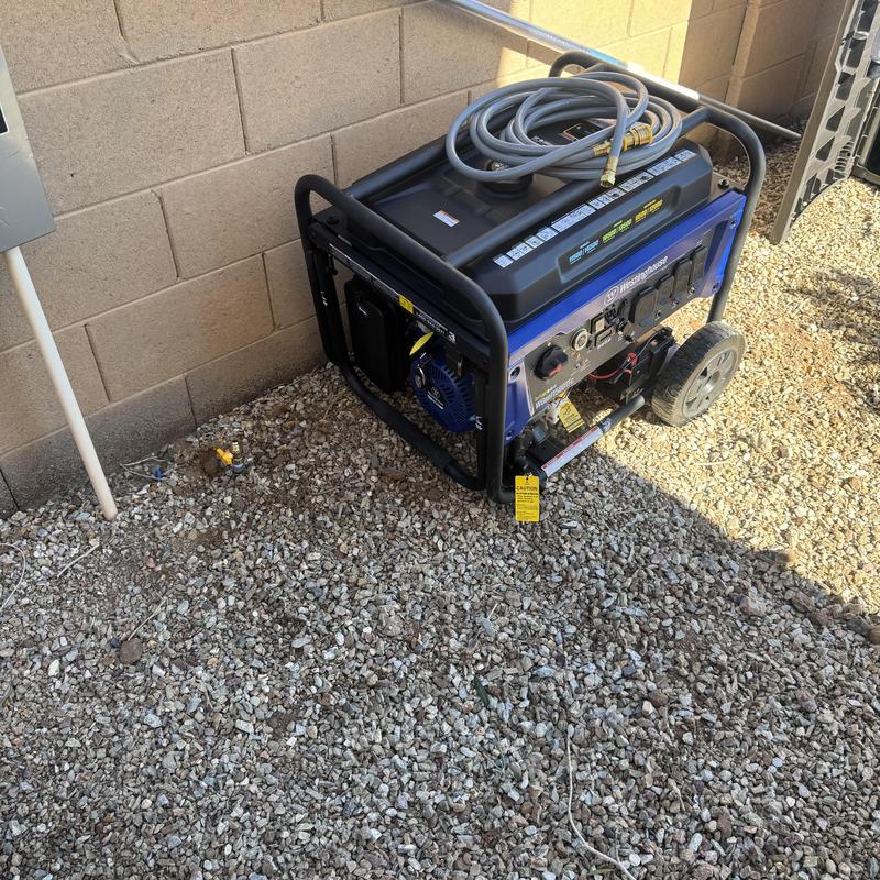 Generator with gas line installation on gravel ground