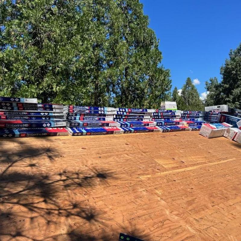 GAF Timberline HD asphalt shingles stacked on roof deck