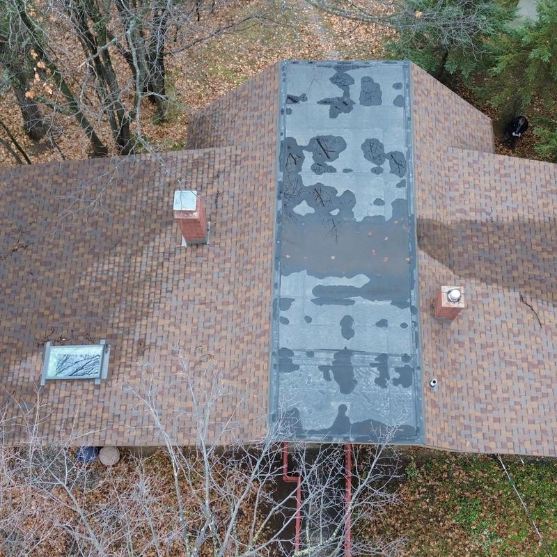 GenFlex EPDM flat roof section with shingle roof sides GenFlex EPDM flat roof section with shingle roof sides