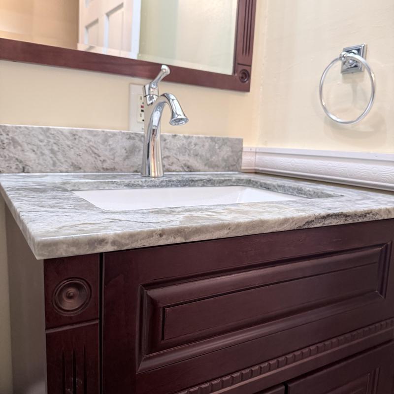 Bathroom vanity with new faucet and countertop