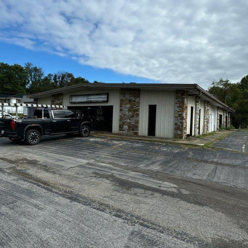 Commercial building roof with hail impact inspection