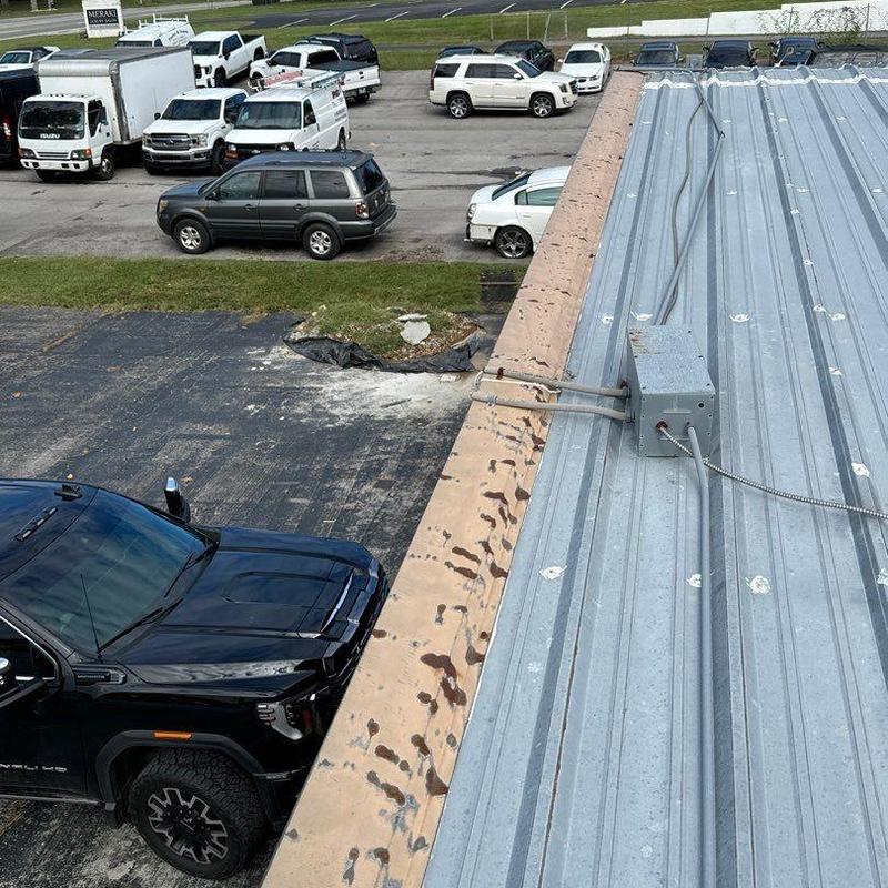 Metal roof hail damage with electrical box and conduit