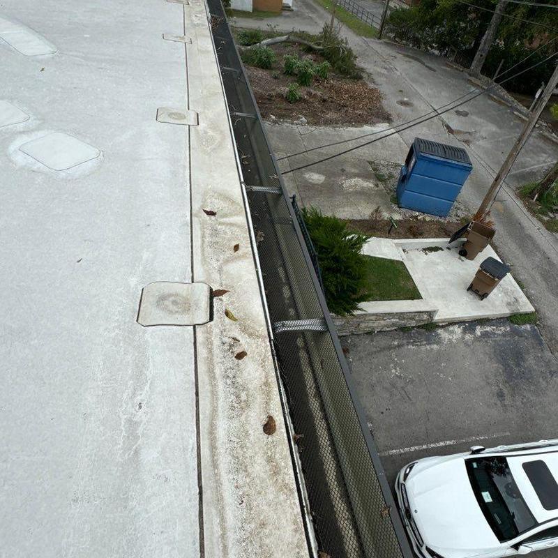 Flat roof edge and gutter mesh guard installation