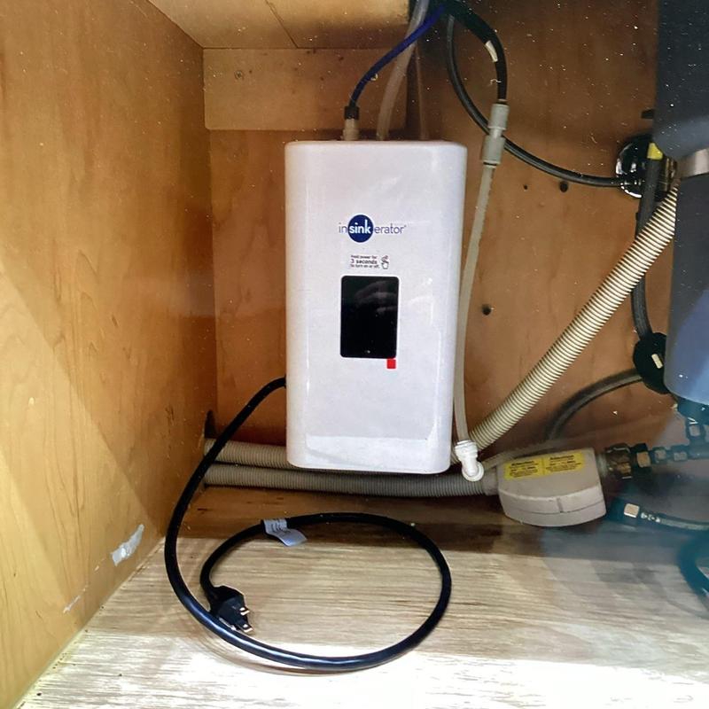 Instant hot water dispenser installed under kitchen sink