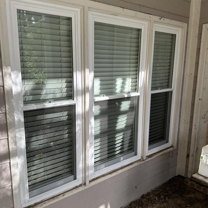 Double hung white insulated window units installed Double hung white insulated window units installed