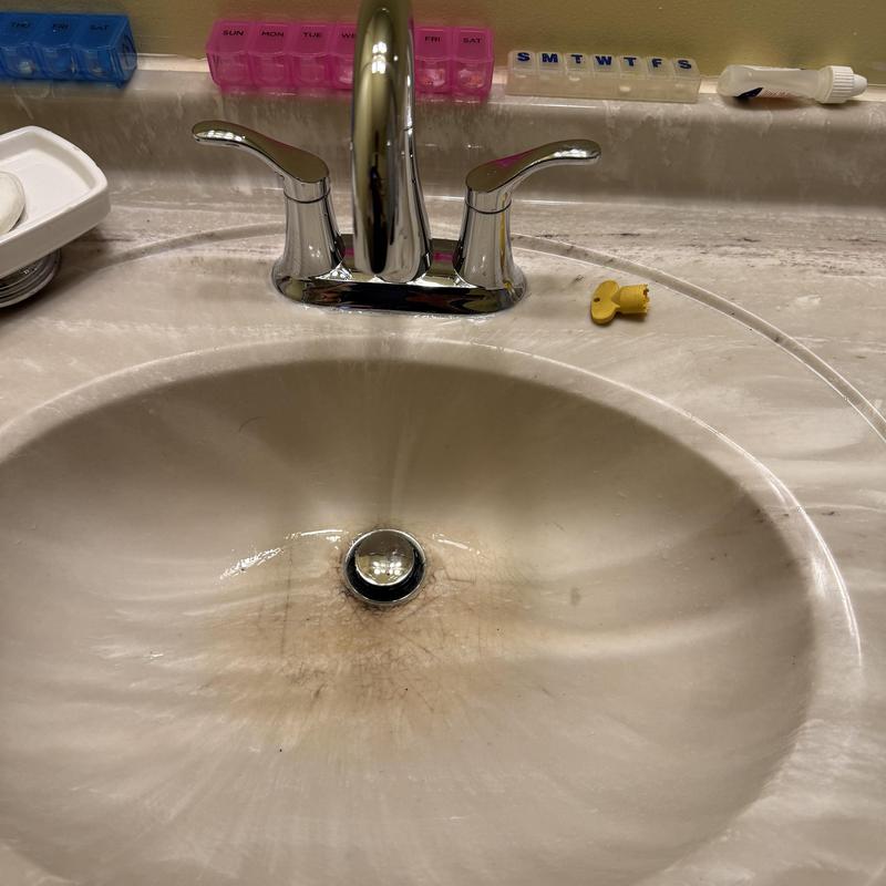 Sink faucet and clogged drain in bathroom sink Sink faucet and clogged drain in bathroom sink