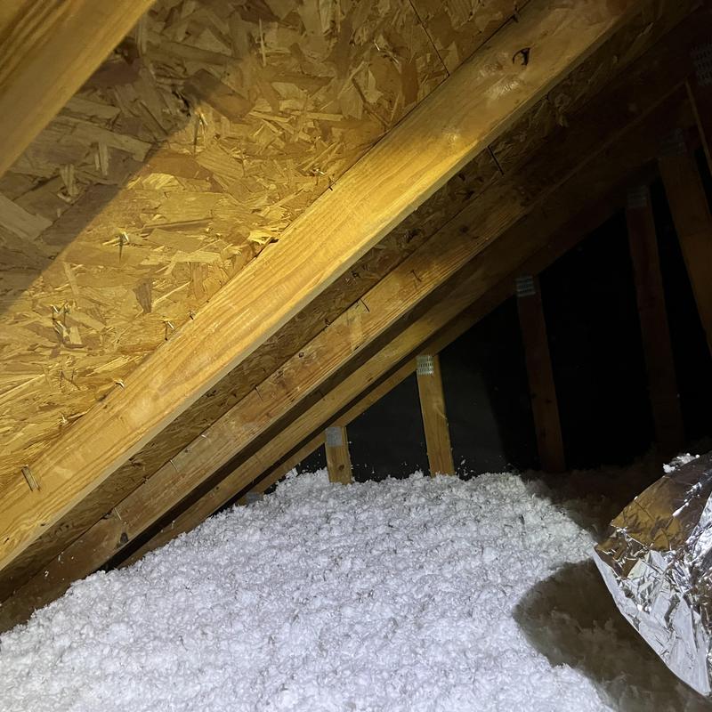 Attic insulation with loose-fill material installed