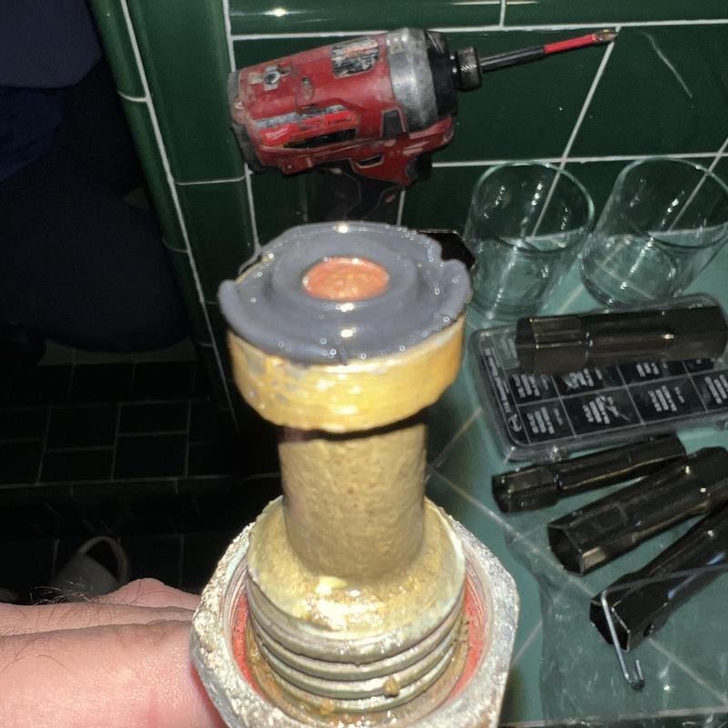 Shower stem with worn washers removed for repair