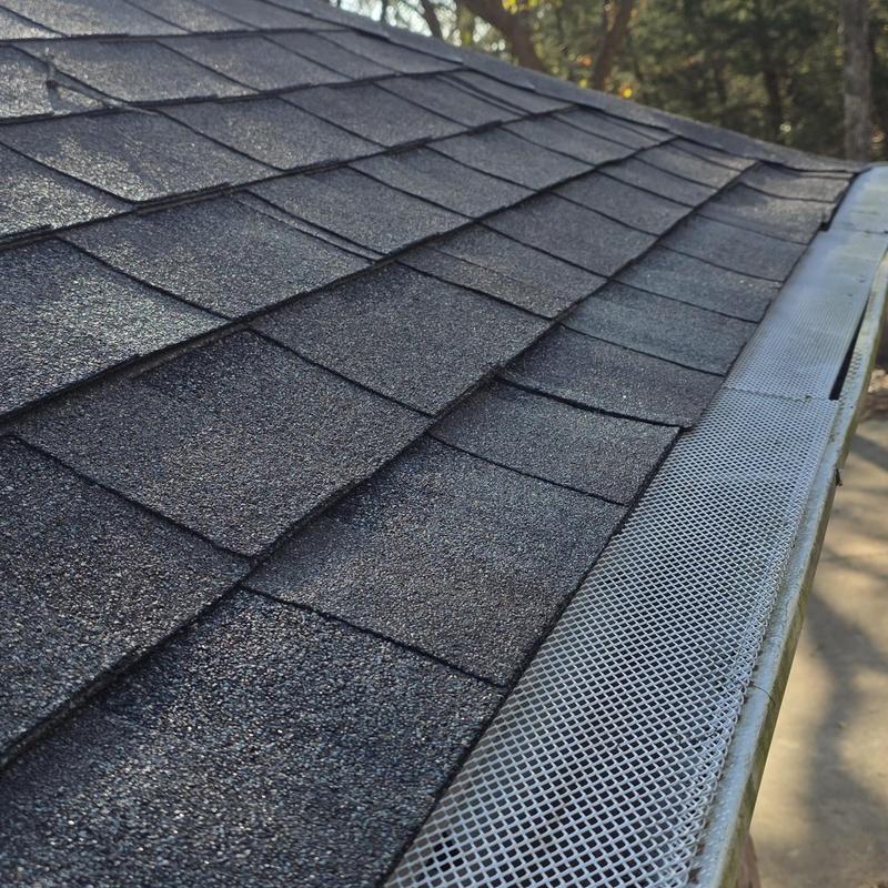 Asphalt shingle roof with gutter guard installed Asphalt shingle roof with gutter guard installed