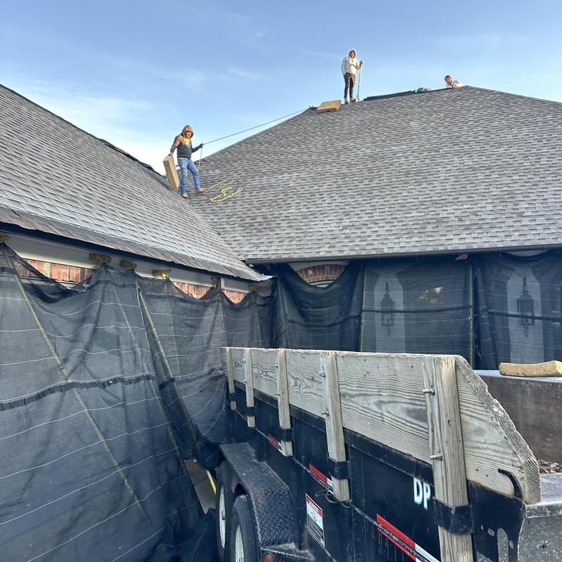 Asphalt shingle roof tear off with safety netting
