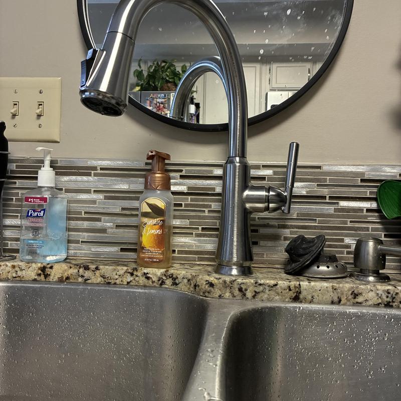 Stainless steel kitchen faucet with pull-down sprayer and granite countertop