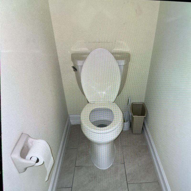 Kohler pressure-assisted toilet installation in bathroom