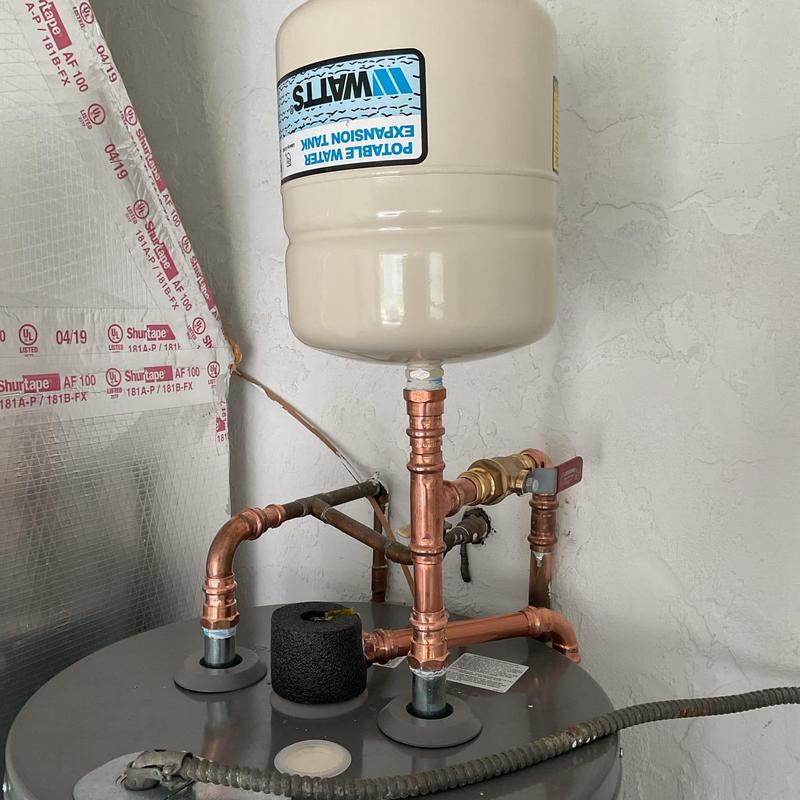 Water heater expansion tank with copper piping installation
