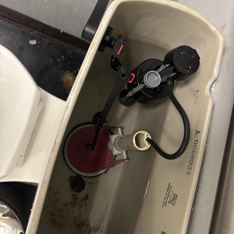 Toilet fill valve and flapper installation inside tank