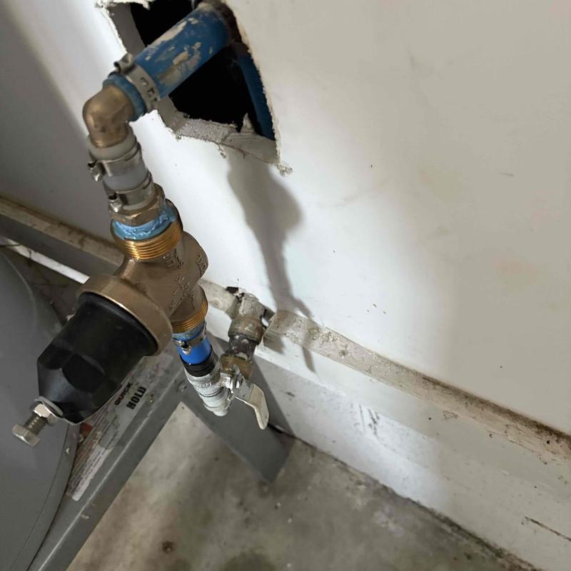 Pressure relief valve with blue PEX piping installation