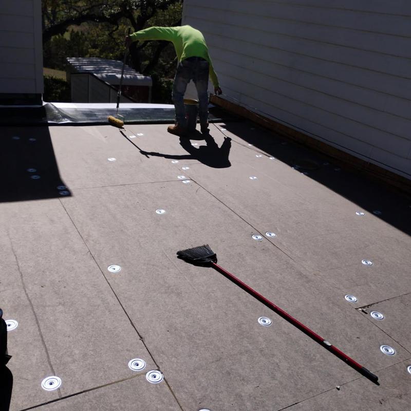 Modified bitumen roof insulation board installation