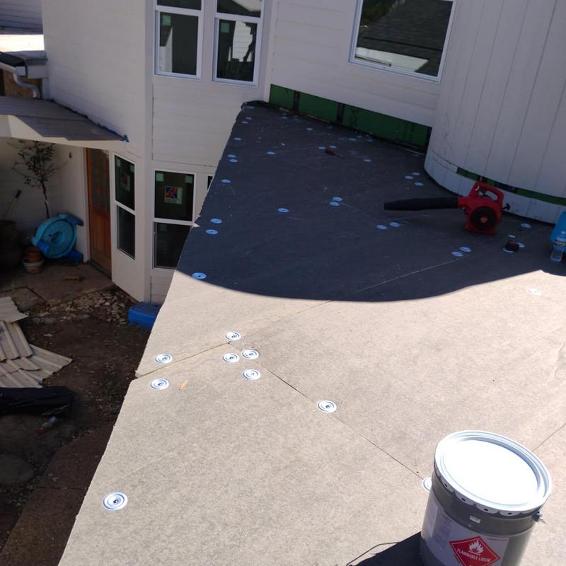 Insulation and cover boards installation on flat roof