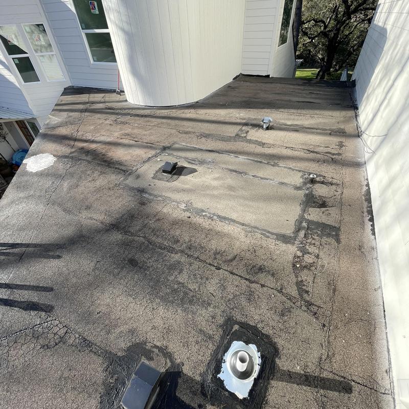 Modified bitumen roof with vents and flashing repairs