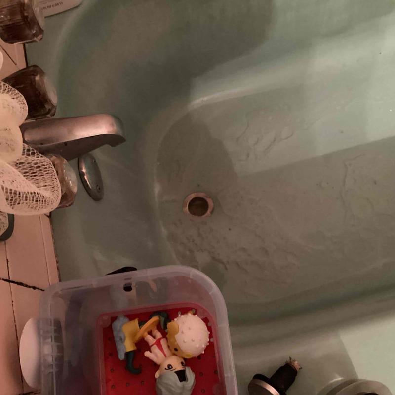 Tub drain with toys in bathtub basin