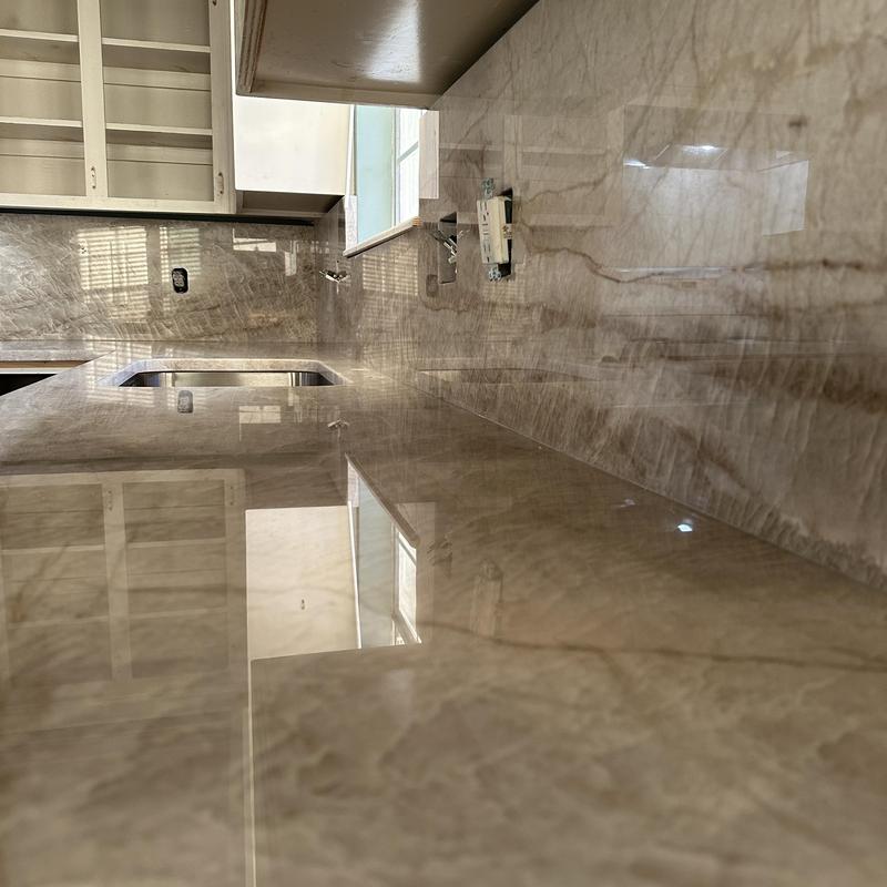 Granite kitchen countertop with backsplash installation Granite kitchen countertop with backsplash installation