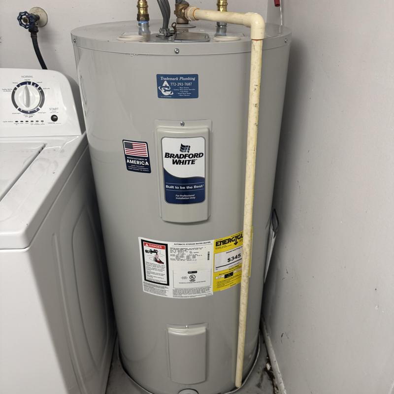 Electric water heater with new ball valves installed