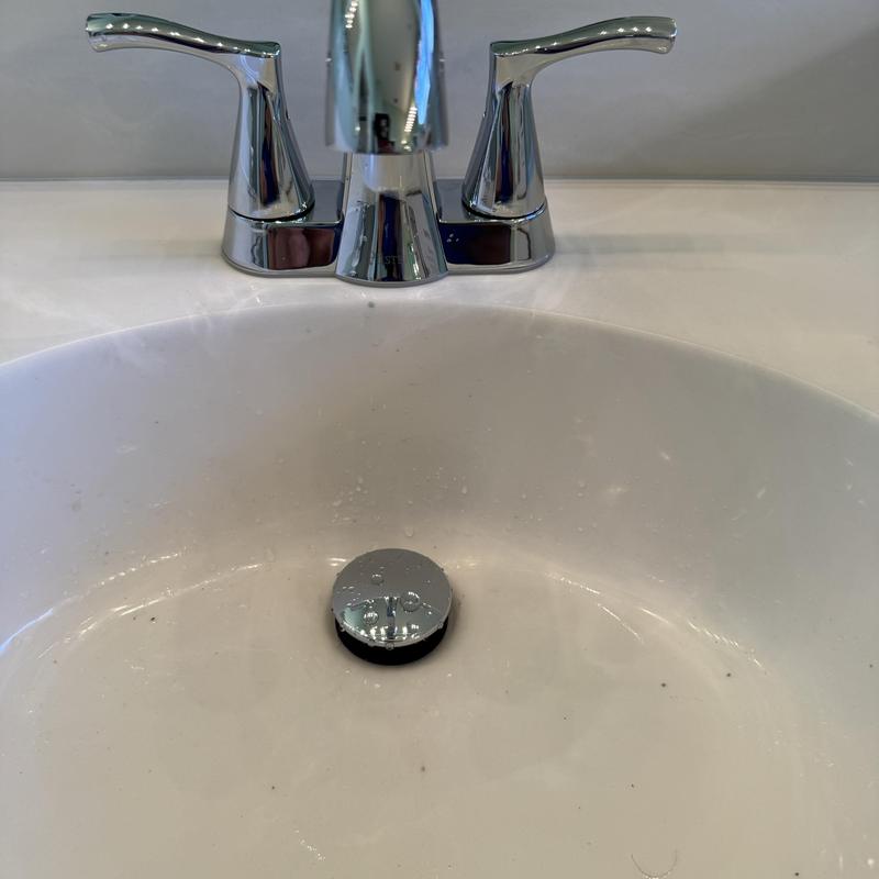 Vanity faucet and sink with chrome fixtures installed