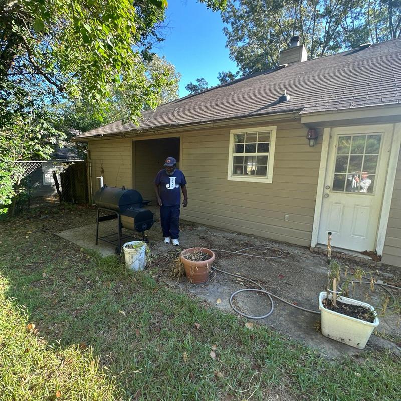 Roof shingles and gutters on residential home exterior Roof shingles and gutters on residential home exterior