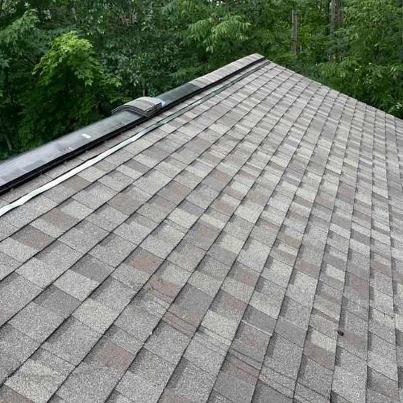 Roof flashing and condensation vent on asphalt shingles Roof flashing and condensation vent on asphalt shingles