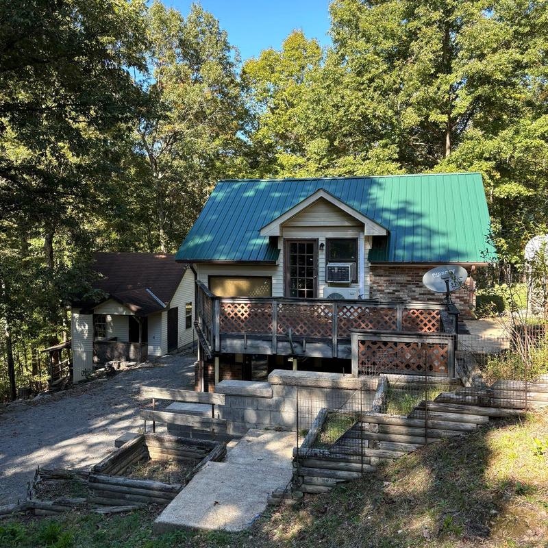 Metal roof on residential home with surrounding trees