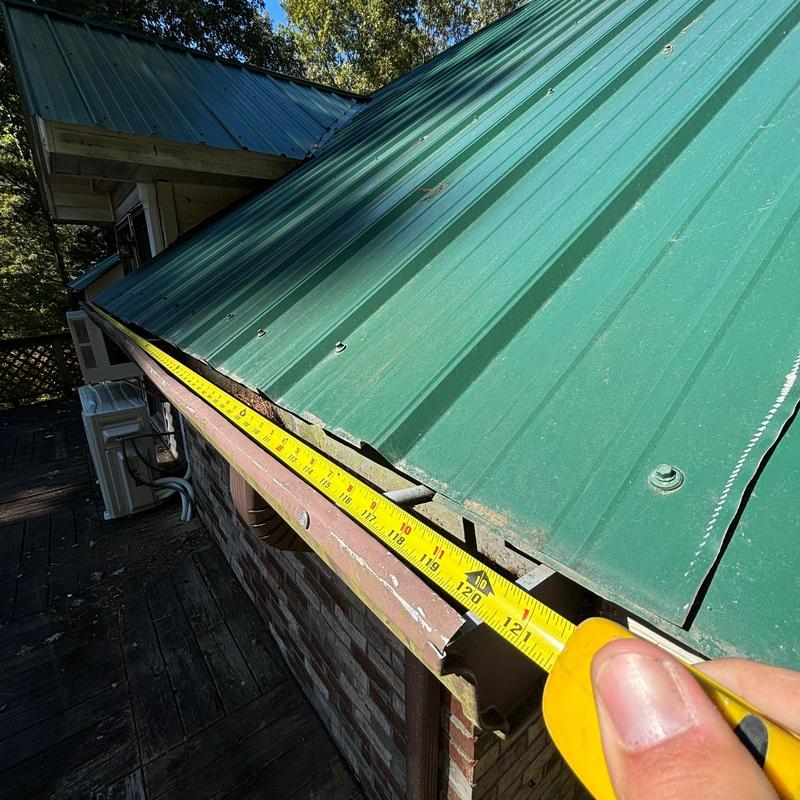 Metal roof panel measurement with tape measure