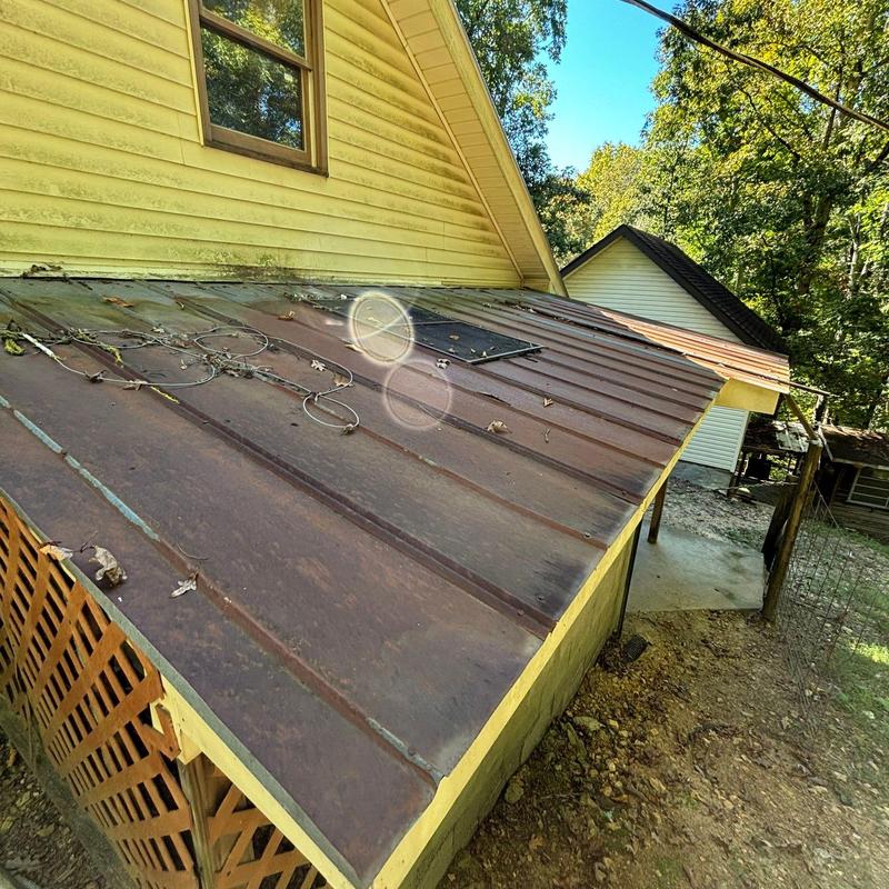 Metal roof panels with electrical wires and solar panel