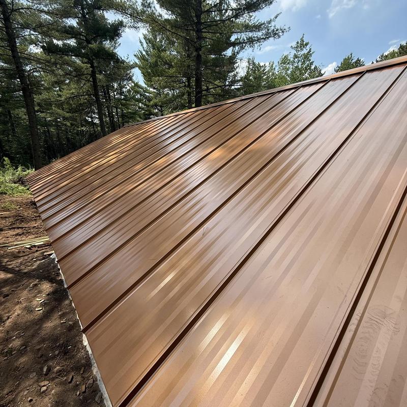 Copper Penny standing seam steel roof panel installation Copper Penny standing seam steel roof panel installation
