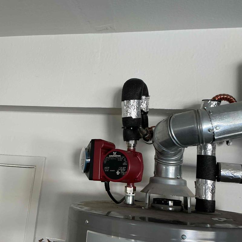 Recirculating pump installed on water heater system