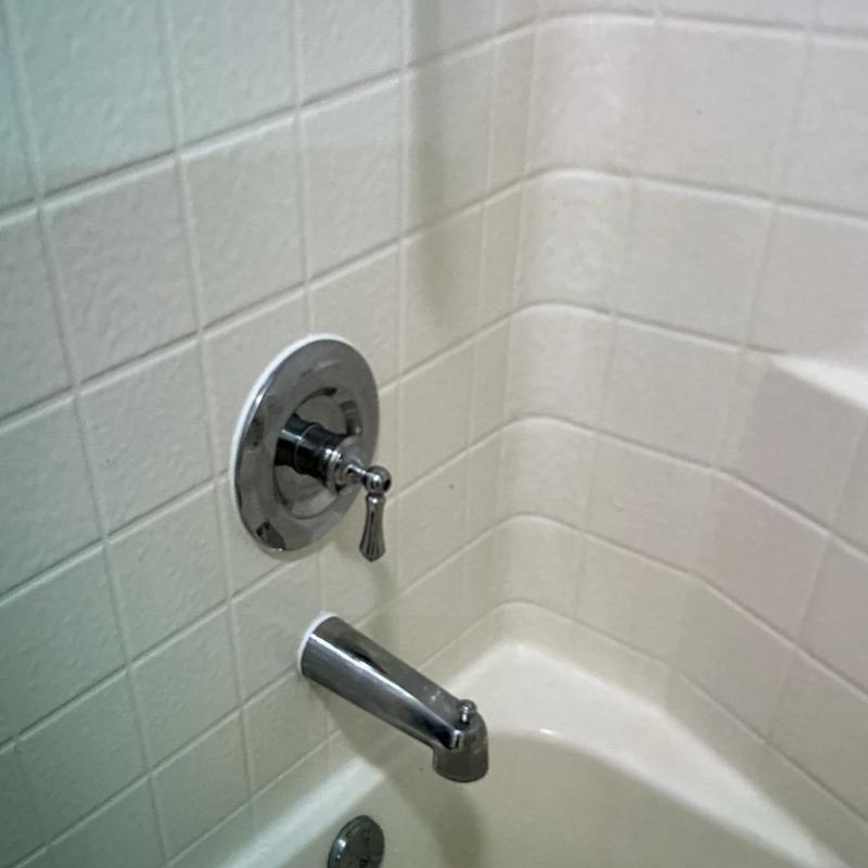 Shower valve with new cartridge installed and tub spout