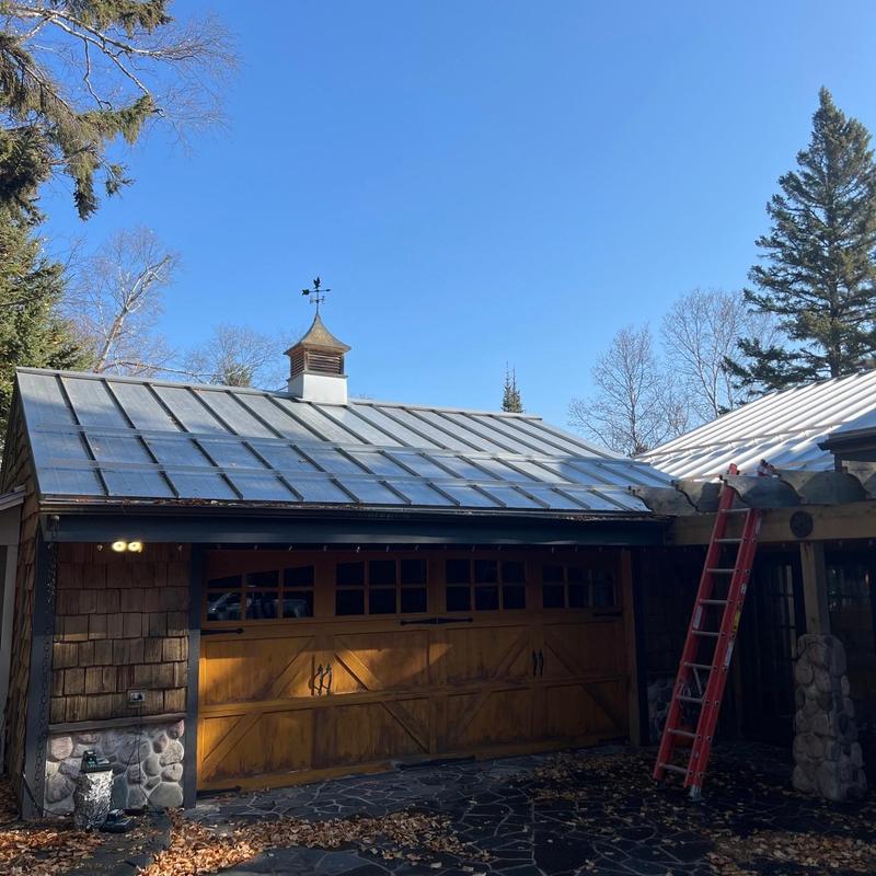 Standing seam steel roof with snow bars installation Standing seam steel roof with snow bars installation