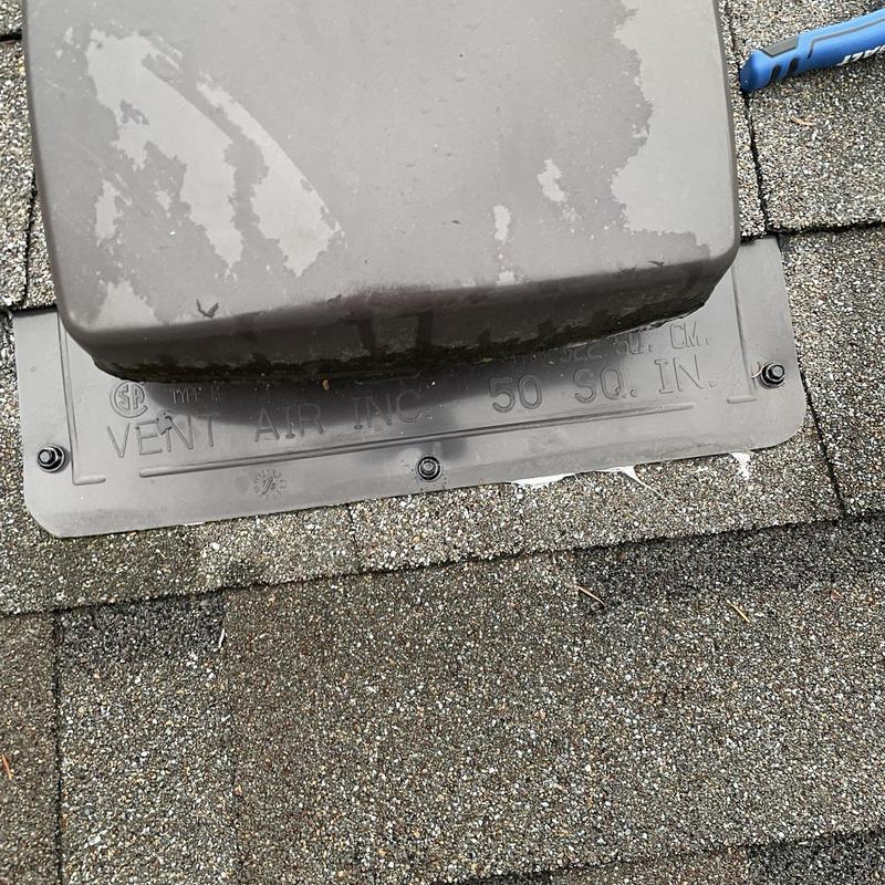 Roof vent flashing with secured fasteners on shingles