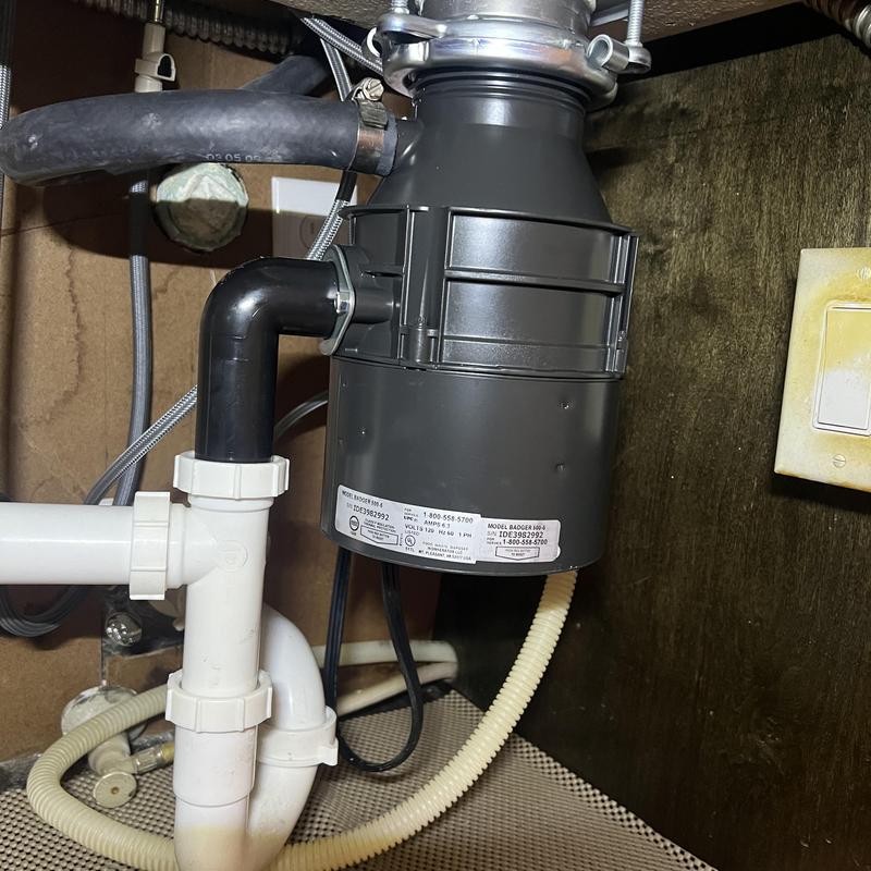 Garbage disposal unit with plumbing connections