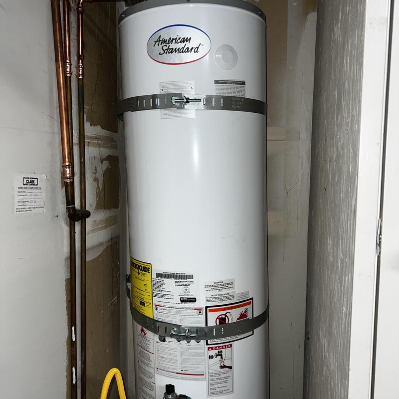 Water heater with new seismic straps and copper piping