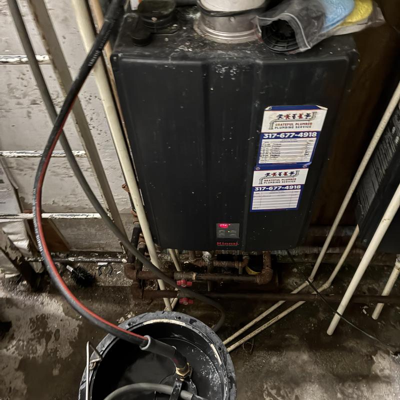 Tankless water heater with maintenance equipment