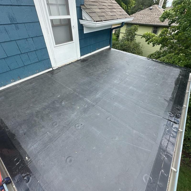 EPDM rubber roof installation on walkout porch deck EPDM rubber roof installation on walkout porch deck